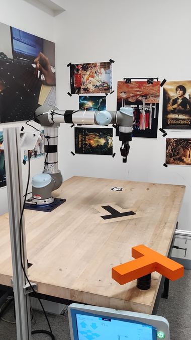 Sample frame from the robot_high capture session, showing the identical desk and Lord of the Rings posters as the main demo.